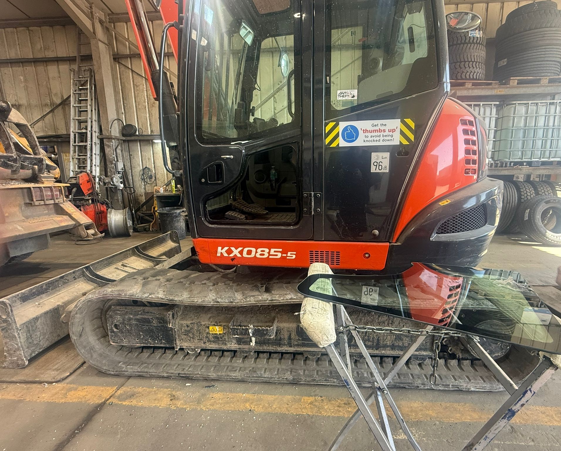 Kubota KX085 excavator in the AWG Windscreens workshop for cab glass replacement